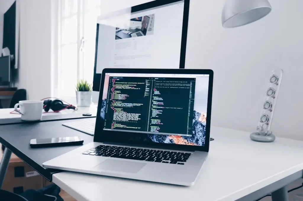 image shows laptop opened website secured with website maintenance services